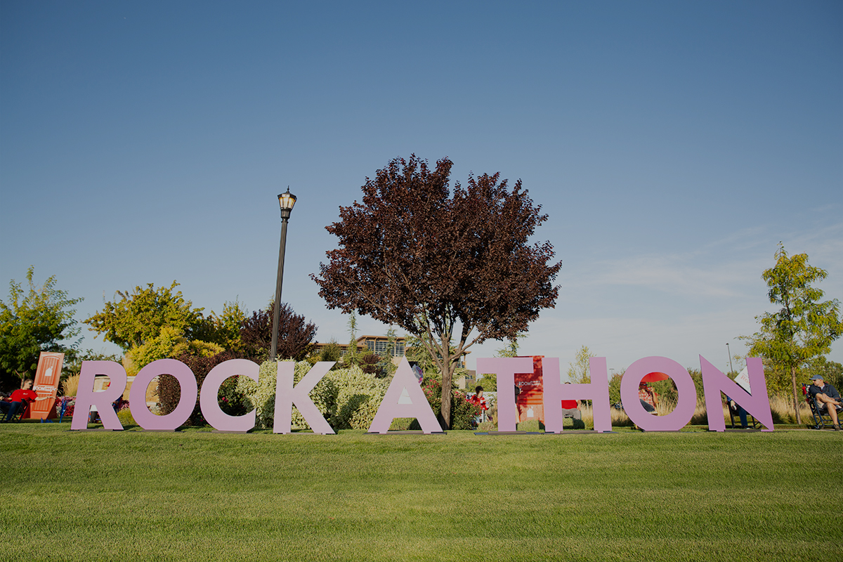 large rock-a-thon sign on lawn